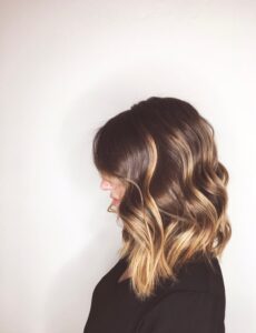 Brunette lob with caramel balayage and soft waves by Leslie Shores, Nashville colorist