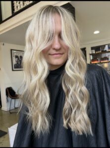 Lived-in blonde with soft waves and shadow root by Alyssa Black, Nashville hairstylist
