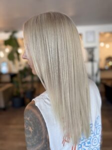 Sleek straight platinum blonde hair from a bleach and tone service by Lauren LeCompte