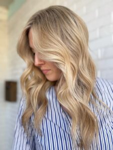 Golden, dimensional blonde balayage styled in soft waves by Lauren LeCompte, Nashville, TN hairstylist
