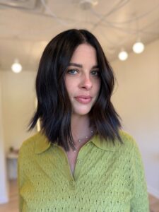 Deep, glossy brunette styled in a soft, wavy lob by Lauren LeCompte, Nashville, TN hairstylist