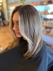 Dark root melt into ash blonde balayage styled sleek and straight by Lauren LeCompte, Nashville, TN hairstylist