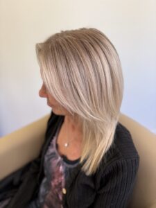 Dark root melt into sleek platinum blonde styled straight with soft layers by Lauren LeCompte, Nashville, TN hairstylist