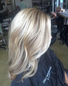 Chunky platinum blonde highlights on a brunette base styled in a wavy lob by Tami Whiteside, Nashville, TN hairstylist