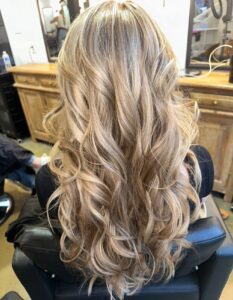 Dimensional beige blonde balayage styled in long, full curls by Tami Whiteside, Nashville, TN hairstylist
