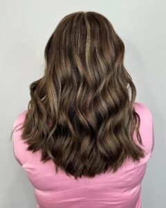 Brunette base with chunky blonde face-framing highlights and soft waves by Gabby Allen, Lebanon, TN hairstylist